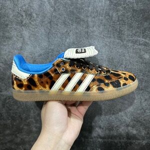 Trendy Adidas Leopard sneakers with sky blue trim